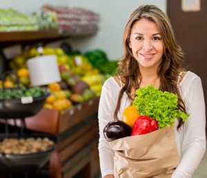 Woman grocery shopping at local market